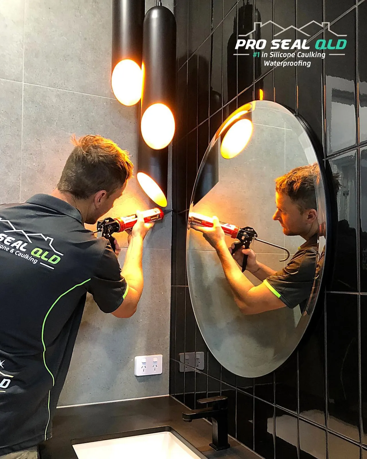 Two Pro Seal technicians working in a bathroom