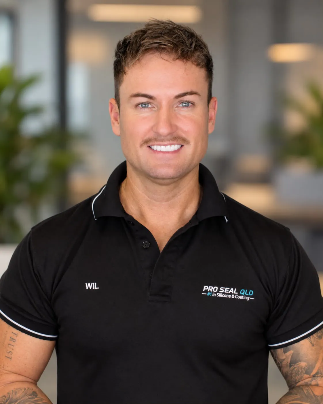Portrait of Wil, Director of Pro Seal QLD, in a black Pro Seal QLD polo